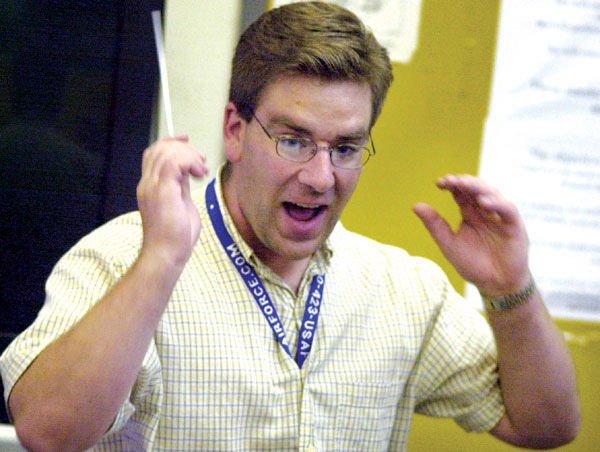 hollister high band director joey fortino face hair hands talk photo