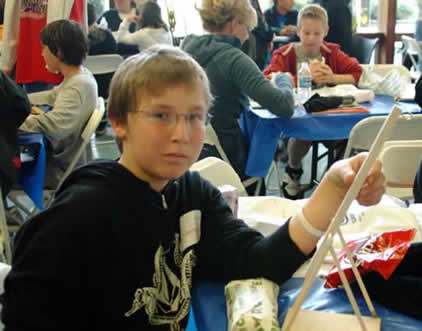 serious thinking boy at science alive