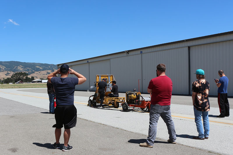 students at new location standing outdoors