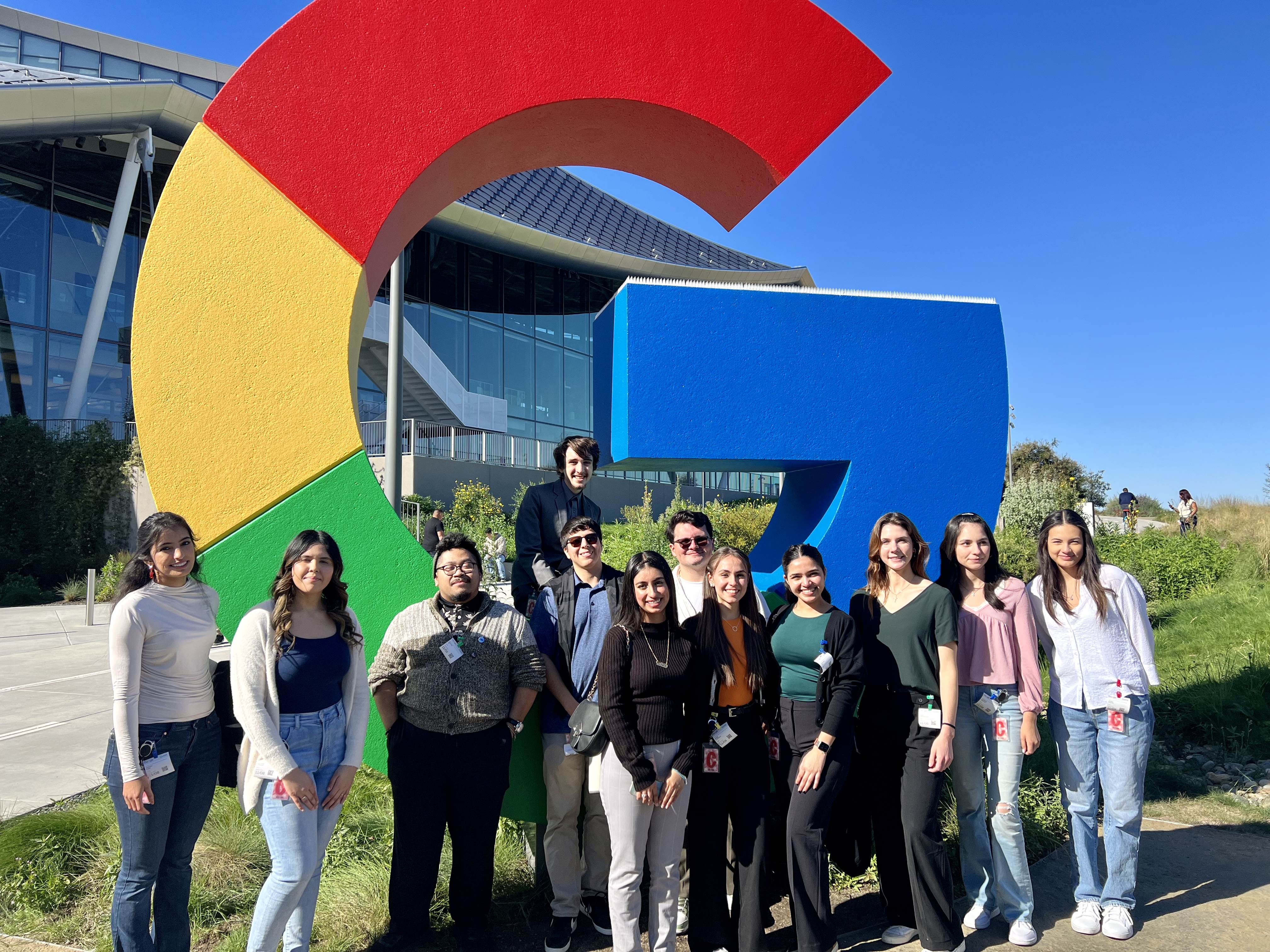 An image of students in front of the Google Logo.