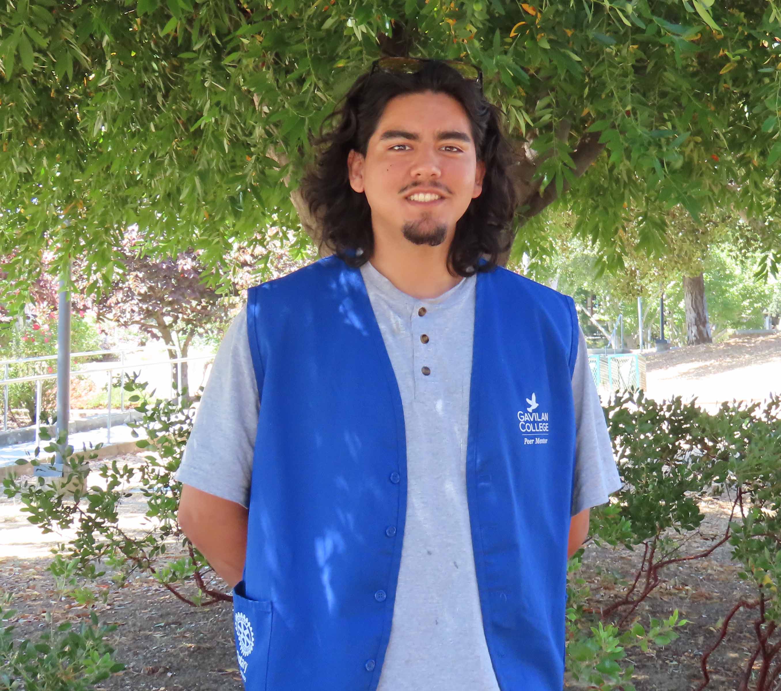 David Martinez wear a blue vest