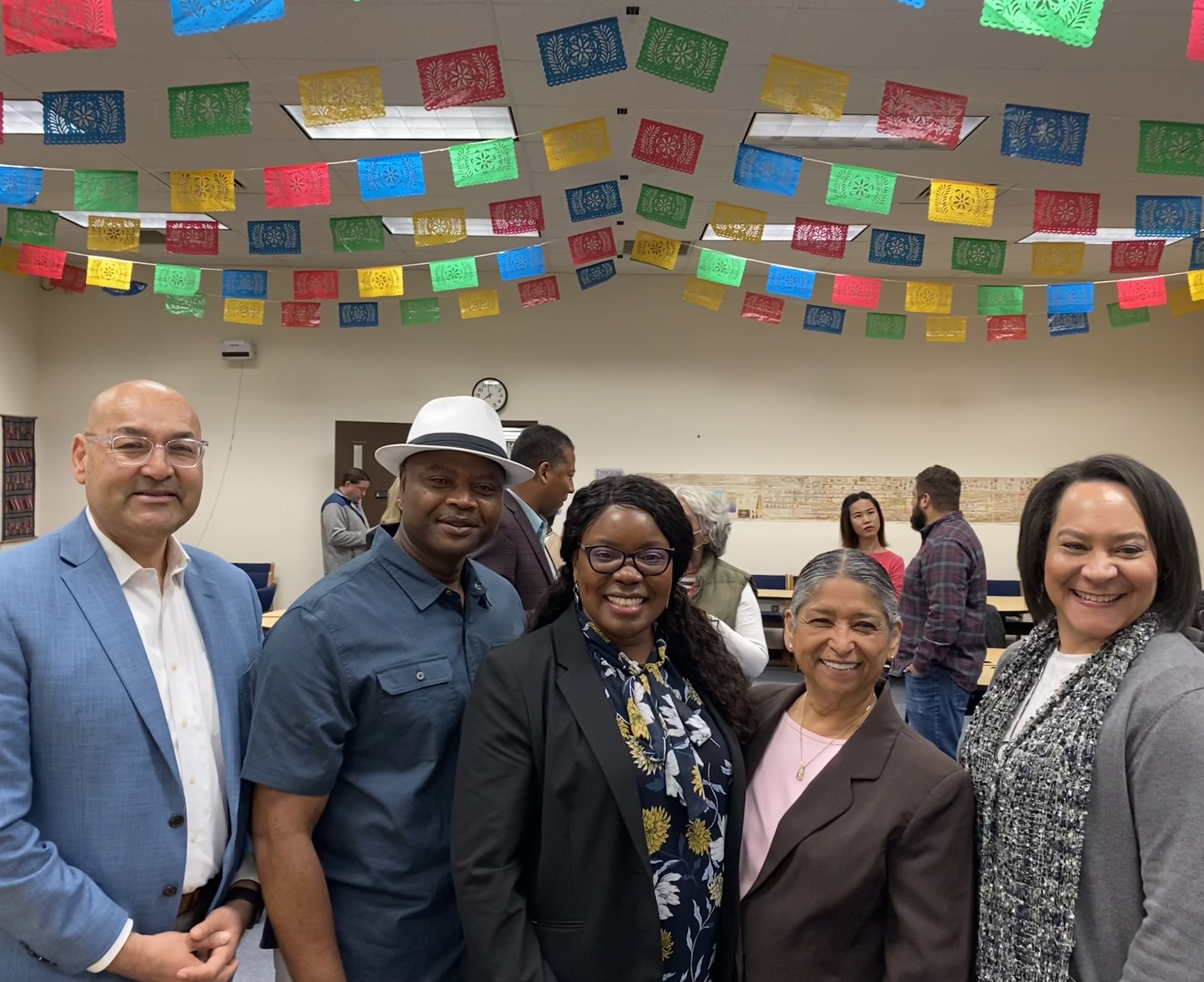 Gavilan College President, Vice President, board member, Marilyn and her husband smiling at the camera