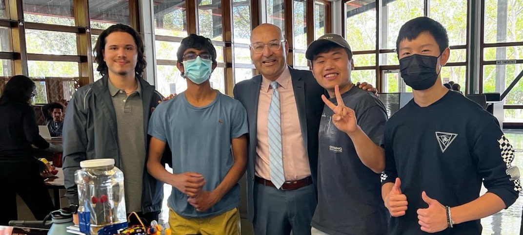 Dr. Avila with four male STEM students