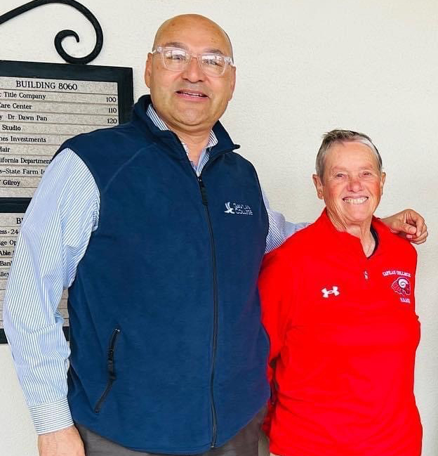 Susan Dodd wearing a red jacket with Dr.Avila wearing a blue vest